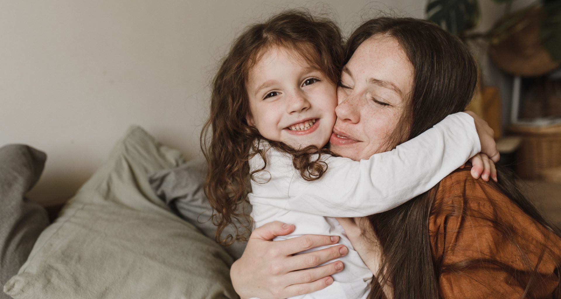 a mother and daughter hugging