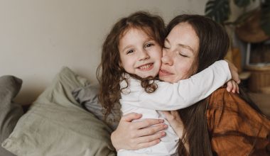a mother and daughter hugging