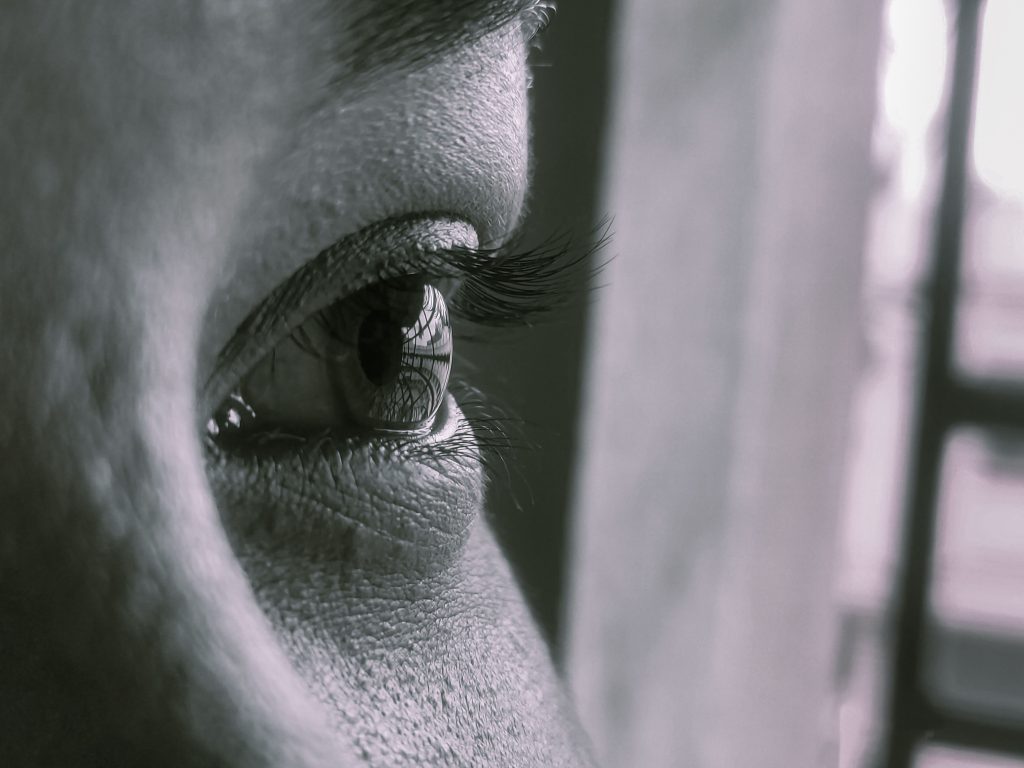 black and white photo closeup of an eye